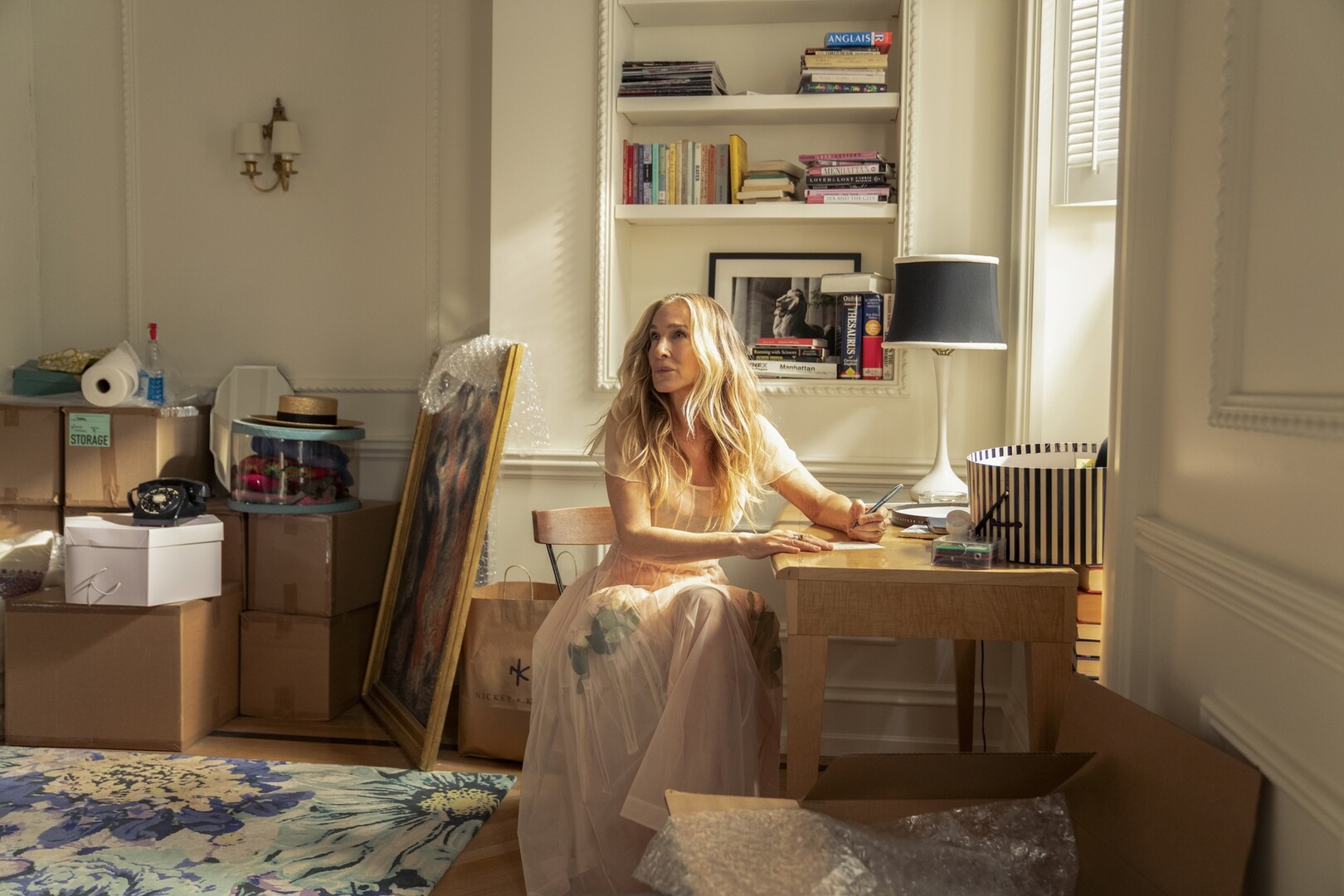 Sarah Jessica Parker at a desk writing
